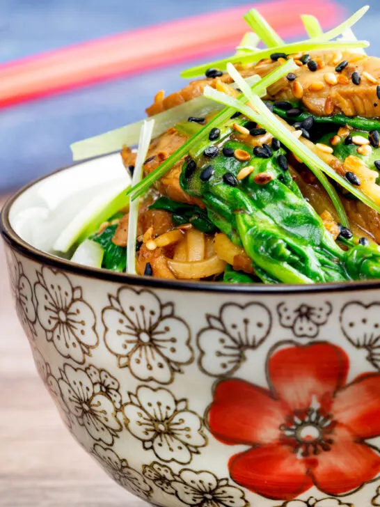 Quick and easy pork stir fry with ginger, Szechuan pepper and whole wheat noodles.