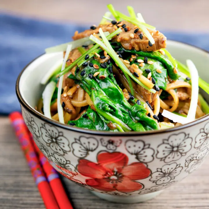 Tenderloin pork noodle stir fry with garlic, Szechuan pepper and spinach.