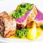 Seared rare tuna steak with a sauce made from capers, parsley, lemon and olive oil.