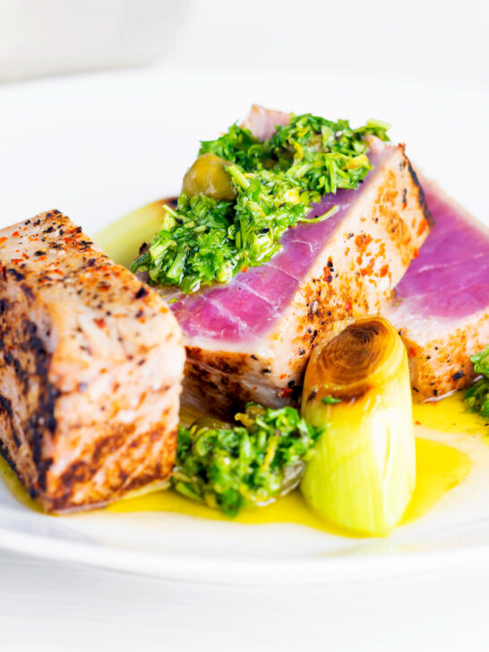 Seared rare tuna steak with a sauce made from capers, parsley, lemon and olive oil.