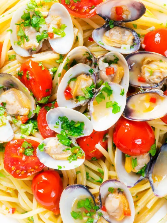 Close-up overhead clam pasta with tomatoes chilli and garlic.