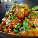 Close-up beef bhuna or bhuna gosht curry in an iron karahi featuring a title overlay.