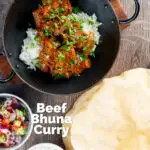 Overhead beef bhuna or bhuna gosht curry with poppadoms, raita and kachumber salad featuring a title overlay.