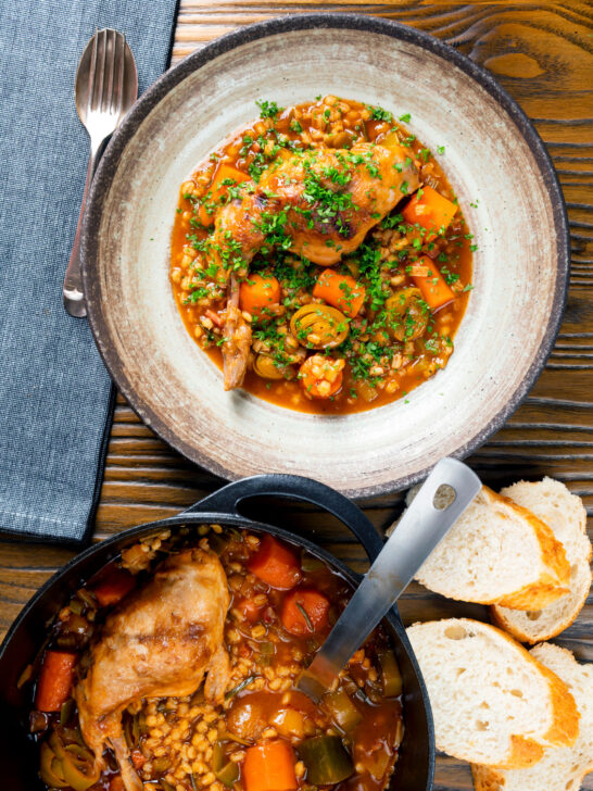 Overhead old fashioned braised rabbit leg stew with pearl barley.