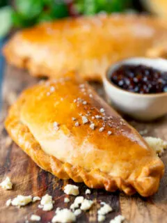 Homemade cheese and onion pasty with Branston pickle in shortcrust pastry.