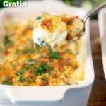 Cheese and breadcrumb topped smoked haddock and potato gratin on a spoon featuring a title overlay.