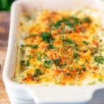 Golden cheesy smoked haddock and potato gratin with spinach and fresh dill.