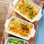 Individual cheesy smoked haddock and potato gratin and fresh dill.