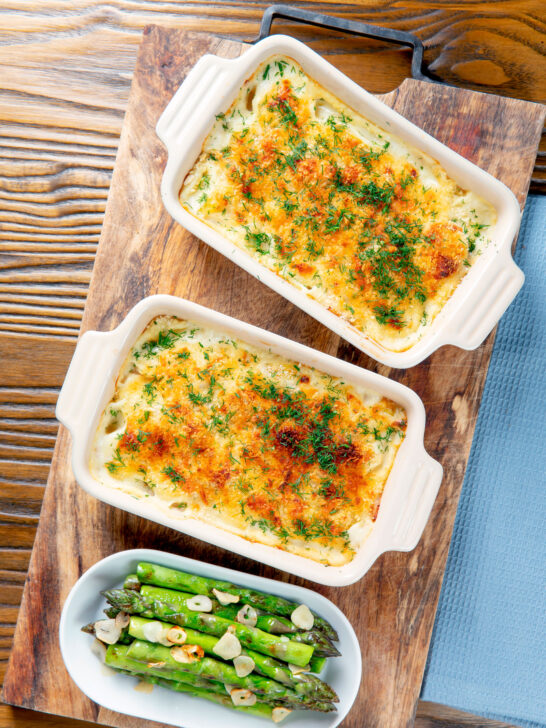 Individual cheesy smoked haddock and potato gratin and fresh dill.