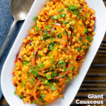 Overhead giant couscous salad with rose harissa paste and oranges featuring a title overlay.