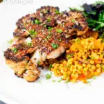 Roasted cauliflower steak served with giant couscous salad featuring a title overlay.