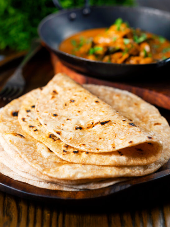 Indian meal of Ceylon chicken curry with homemade chapati flatbreads.