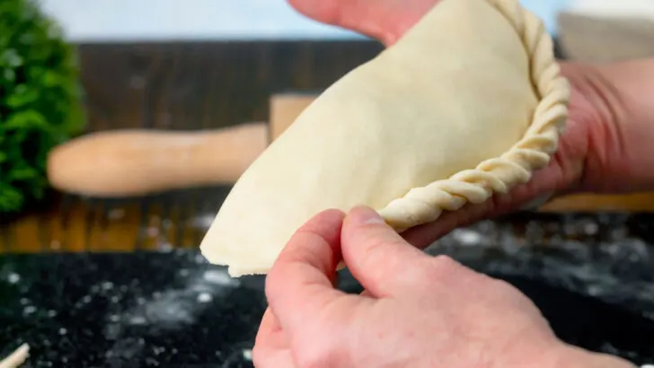 Part 7 of 9: Photographic instructions of how to crimp a British pasty style pie.