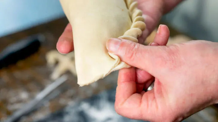 Part 8 of 9: Photographic instructions of how to crimp a British pasty style pie.