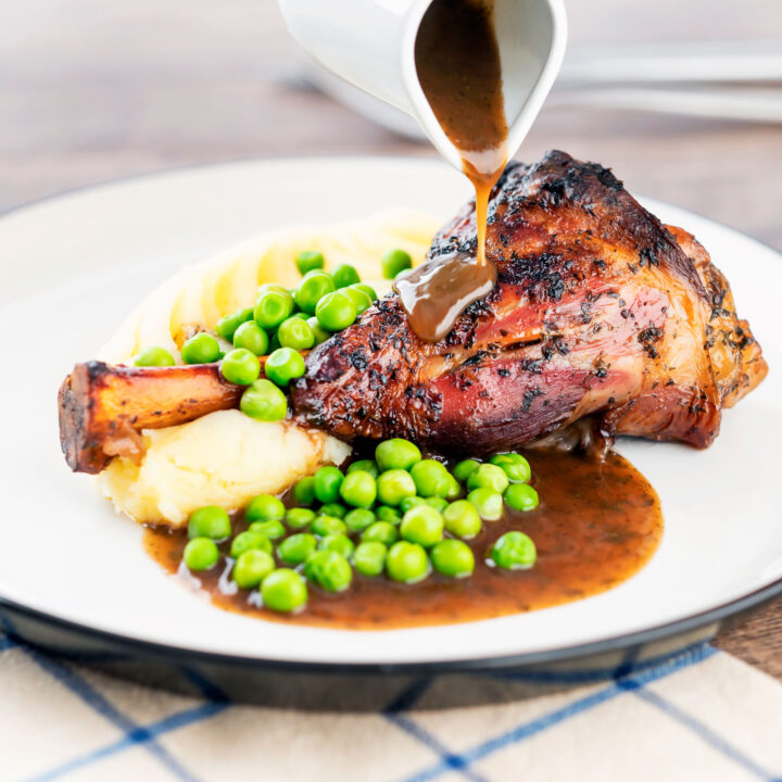 Part roast, part braised minted lamb shanks with mashed potato, peas and gravy.