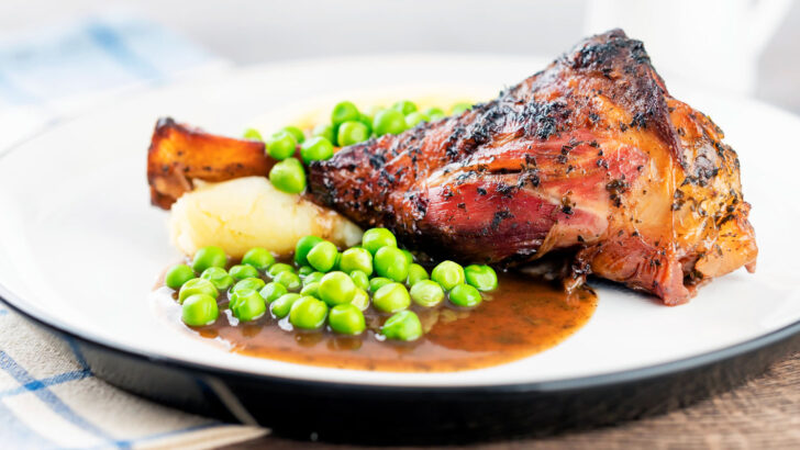 Part roast, part braised minted lamb shanks with mashed potato, peas and gravy.