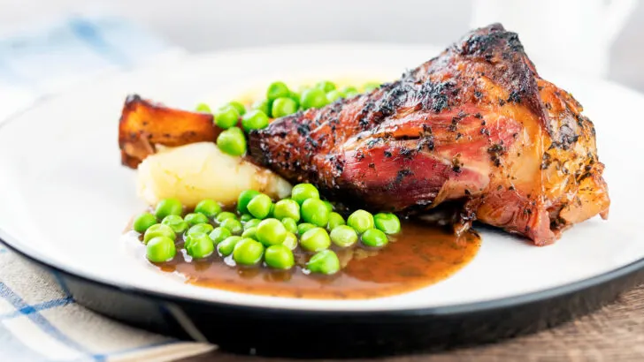 Part roast, part braised minted lamb shanks with mashed potato, peas and gravy.