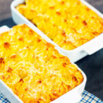 Cheesy mash topped individual vegetarian shepherd's pie or shepherdess pie featuring a title overlay.