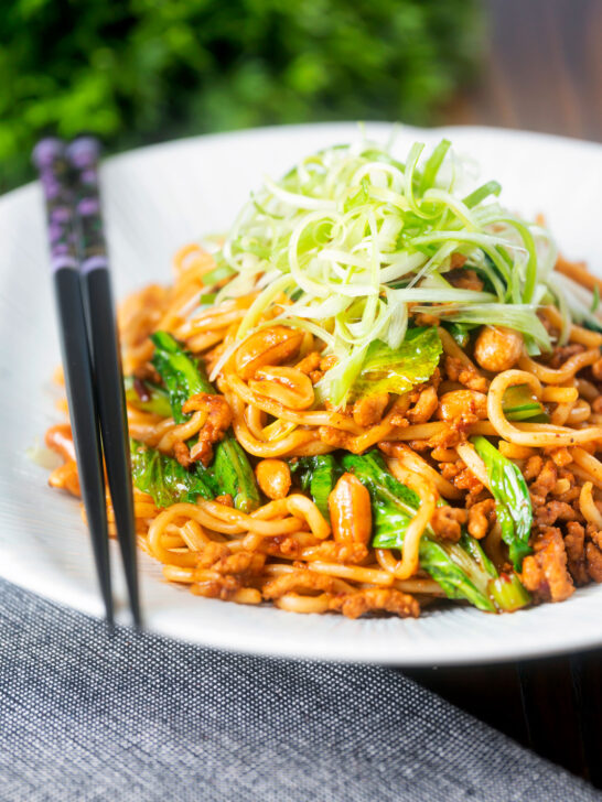 Dan dan noodles, a spicy pork mince stir fry with peanuts and chilli with spring onions.