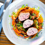 Overhead roasted sweet and sour pork fillet with mixed peppers.