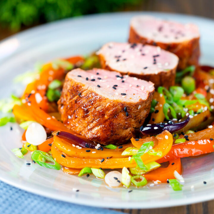 Oven roast sweet and sour pork tenderloin or fillet with mixed peppers.