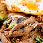 Close-up shredded teriyaki duck leg served as part of a donburi rice dish featuring a title overlay.