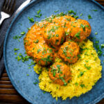 Overhead venison meatballs in an Indian-style yoghurt-based curry sauce with pilau rice.