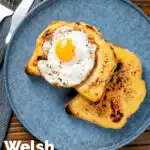 Overhead Welsh rarebit or British cheese on toast with a fried egg featuring a title overlay.