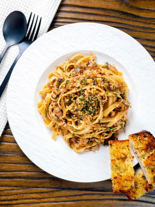 Overhead chicken and sage pasta with sweet onions and sage crumb.
