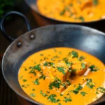 Indian shahi paneer curry in a creamy sauce served with fresh coriander.
