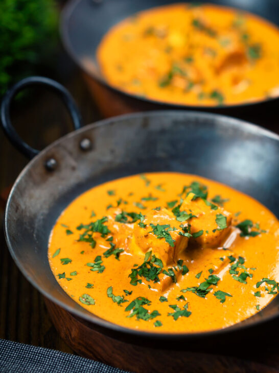 Indian shahi paneer curry in a creamy sauce served with fresh coriander.