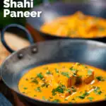 Creamy Indian shahi paneer curry served with naan bread in an iron karai featuring a title overlay.