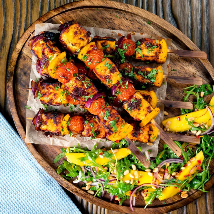 Halloumi kebabs with a harissa glaze, peppers, tomatoes and onion served with mango salad.