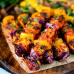 Harissa halloumi and vegetable kebabs served with a spicy mango salad.