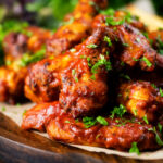 Spicy, sweet and sour sticky date and harissa chicken wings.