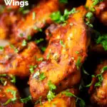 Close-up spicy, sweet and sour sticky date and harissa chicken wings featuring a title overlay.