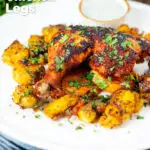 Easy roast chicken legs served with onion and Bombay roast potatoes featuring a title overlay.