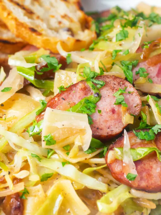 Close-up Polish pasta or lazanki with kielbasa sausage, cabbage and sauerkraut.