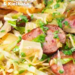 Close-up Polish pasta or lazanki with kielbasa sausage, cabbage and sauerkraut featuring a title overlay.