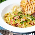 Polish noodles or lazanki with kielbasa sausage and cabbage served with bread and sauerkraut featuring a title overlay.