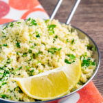 Plain buttered couscous with lots of chopped fresh herbs and a lemon wedge.