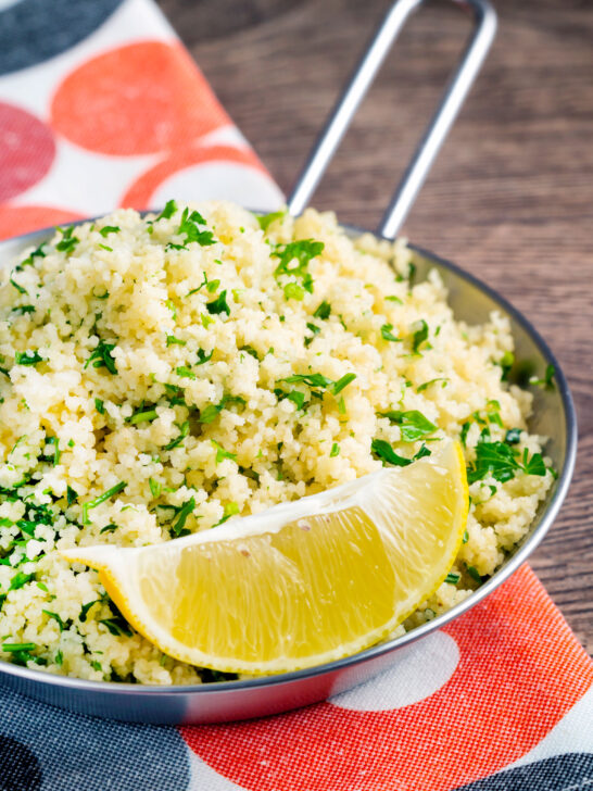 Plain buttered couscous with lots of chopped fresh herbs and a lemon wedge.