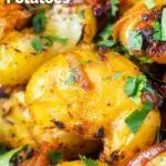 Close-up oven roast Bombay potatoes or Bombay aloo with fresh coriander featuring a title overlay.