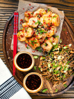 Overhead salt and pepper prawns with a chilli dipping sauce and soba noodle salad.