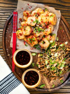 Overhead salt and pepper prawns with a chilli dipping sauce and soba noodle salad.