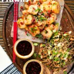 Overhead salt and pepper prawns with a chilli dipping sauce and soba noodle salad featuring a title overlay.
