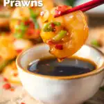 Close-up Chinese salt and pepper prawn dipped into a chilli dipping sauce featuring a title overlay.