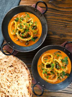 Overhead Indian-influenced squid ring curry in a coconut sauce.