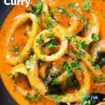 Close-up overhead Indian-influenced calamari ring curry in a spicy coconut sauce featuring a title overlay.