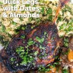 Close up overhead tamarind and honey glazed duck leg with stewed onions and couscous featuring a title overlay.